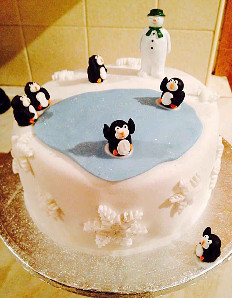 Meet our penguins a personality packed fondant covered Christmas cake.