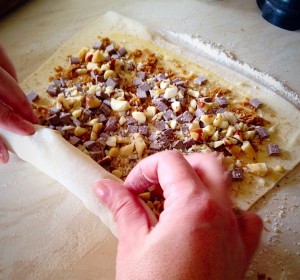Roll the pastry tightly and evenly.