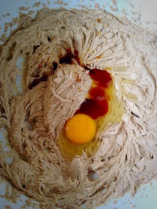 Add in the egg and vanilla extract to the whisked butter/sugar.