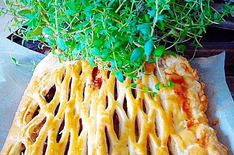 Fresh thyme and a savoury meat pastry with lattice top.