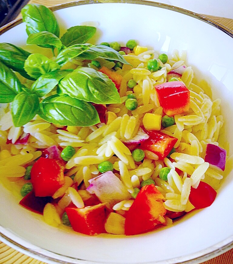 Orzo with vegetables and a lemon and garlic dressing.