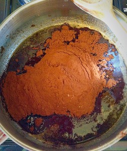 Add the cocoa to the melted butter/sugar, off the heat.