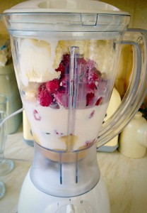 Break up the bananas and place in a blender. Add the frozen raspberries, ice cream and milk - then BLITZ until completely smooth.