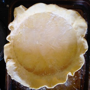 Transfer the pastry by rolling it around the rolling pin and then carefully unrolling over the Quiche tin.
