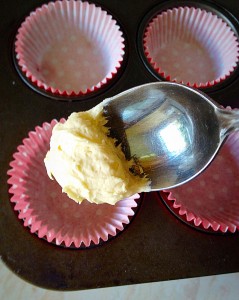 Place approx 1 teaspoonful of the batter into the bottom of each cupcake case.