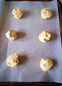 Using a 5cm/2" ice cream scoop, or your hands, make balls of cookie dough and place on the parchment lined baking sheet.