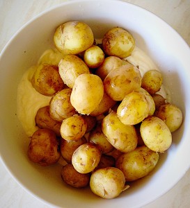 Add the potatoes to the bowl.