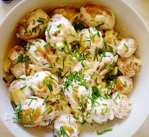 Snip the fresh chives over the top of your Tangy Potato Salad.