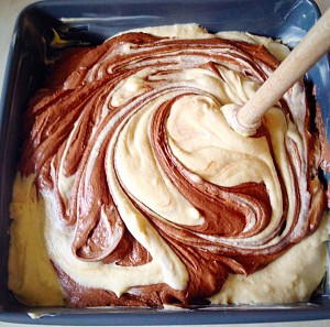 Malted Marbled Chocolate Cake - using the handle of a wooden spoon swirl the two batters together, without mixing them into each other.