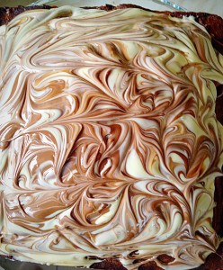 The swirled chocolate topping perfects finishes this Malted Marbled Chocolate Cake.