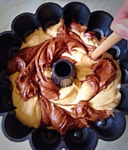 Using a wooed spoon handle, gently swirl it through the batter. This will give the marbled effect once baked.