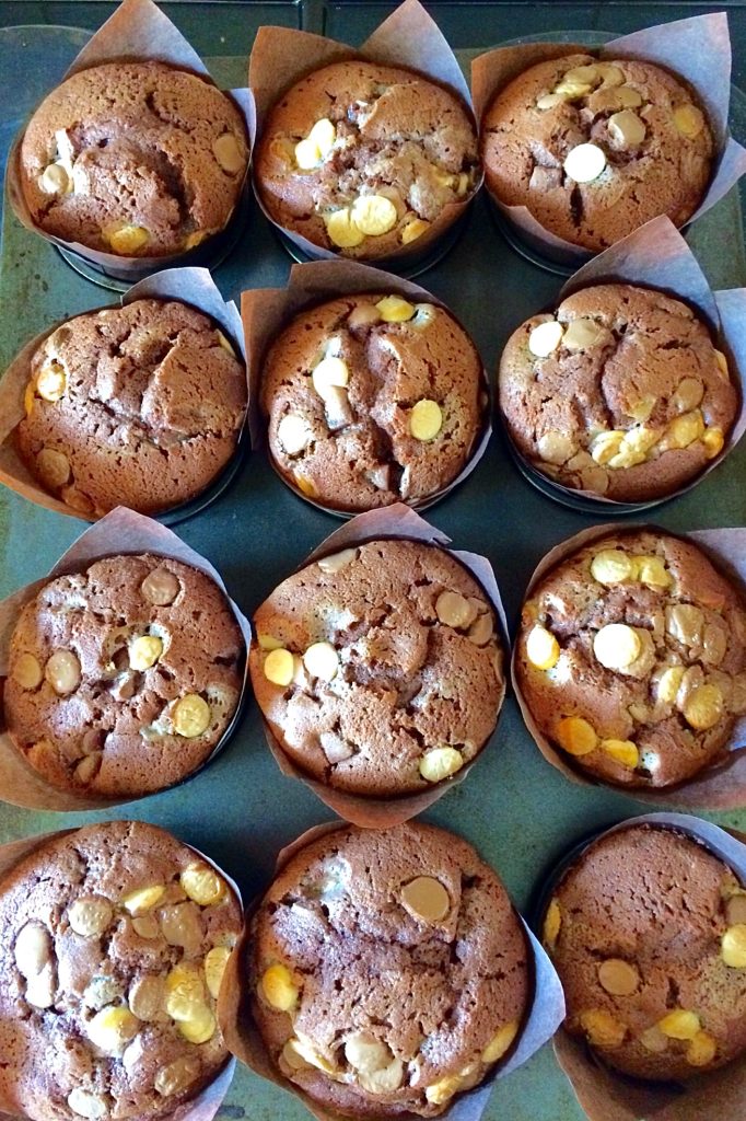 Freshly baked muffins in a tray.