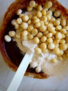 Add the macadamia nuts on top of the sieved flour.