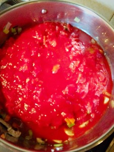 Add all of the tinned chopped tomatoes.