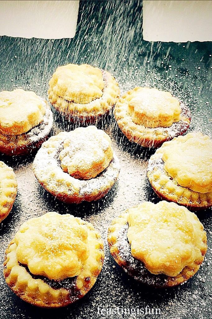 Christmas mini mince pies made using a tangy cream cheese pastry recipe. Covered with a festive flurry of icing sugar snow.