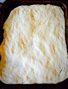 The dough will stretch to fill the baking sheet. 
