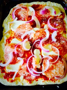 Add the toppings of your choice. I've used Italian salami and sliced red onion.