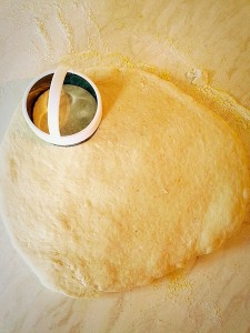 Roll out the dough, moving it regularly so it doesn't stick, until it is about 1/2 inch thick.