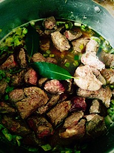Add the steak, herbs and garlic back to the pan. Add an additional 500ml of water.