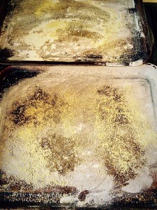 Prepare the baking sheets by sprinkling with flour and polenta.