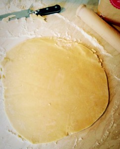 Roll out the pastry so that it is 1" wider that the top of the pie dish. Trim the pastry so it has a neat edge.