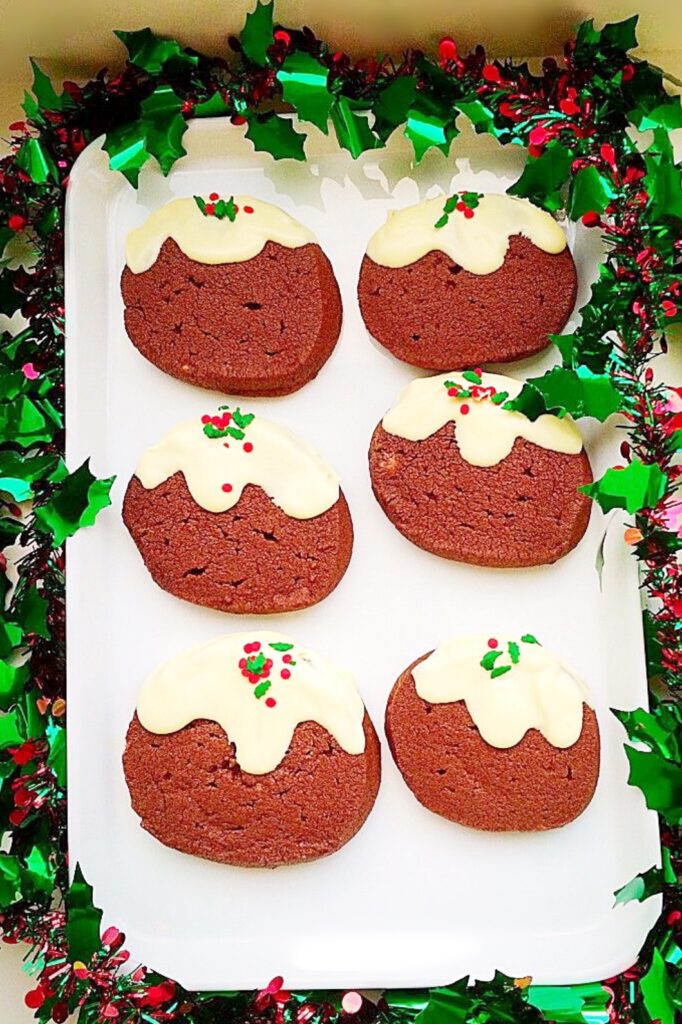 Christmas cookies decorated to look like Christmas puddings.