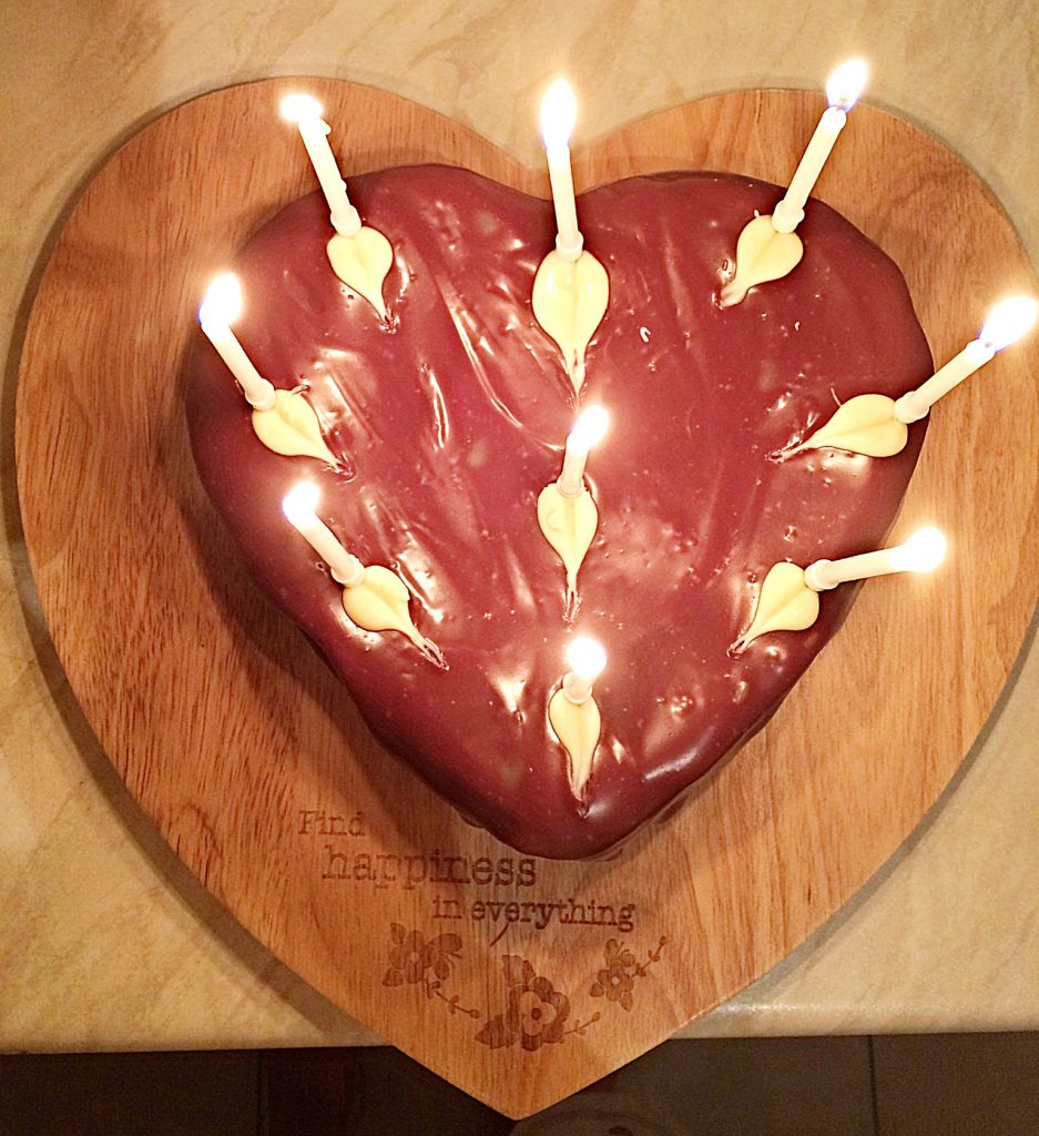 Chocolate Heart Cake with birthday candles.