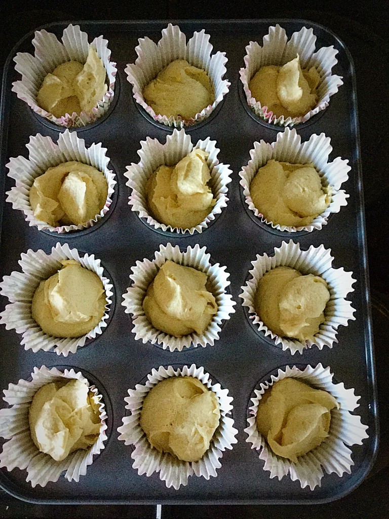 Fill each cupcake case half way with cake batter.
