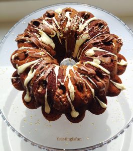Marbled chocolate bundt cake topped with both white and milk chocolate and mini gold stars.