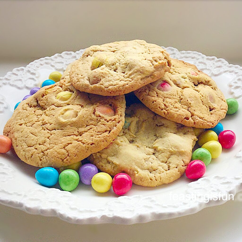 Colourful, large Easter biscuits on a white plate.