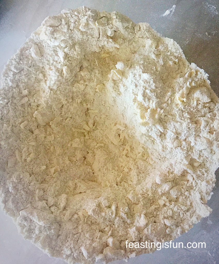 You can clearly see pieces of butter throughout the flour.
