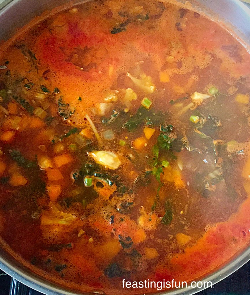 Hearty Minestrone Soup reducing over a low heat.