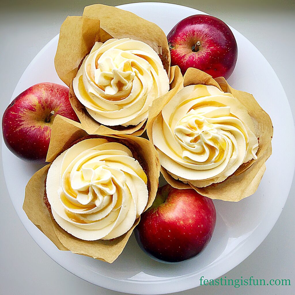 Maple syrup swirled frosting on apple cupcakes.