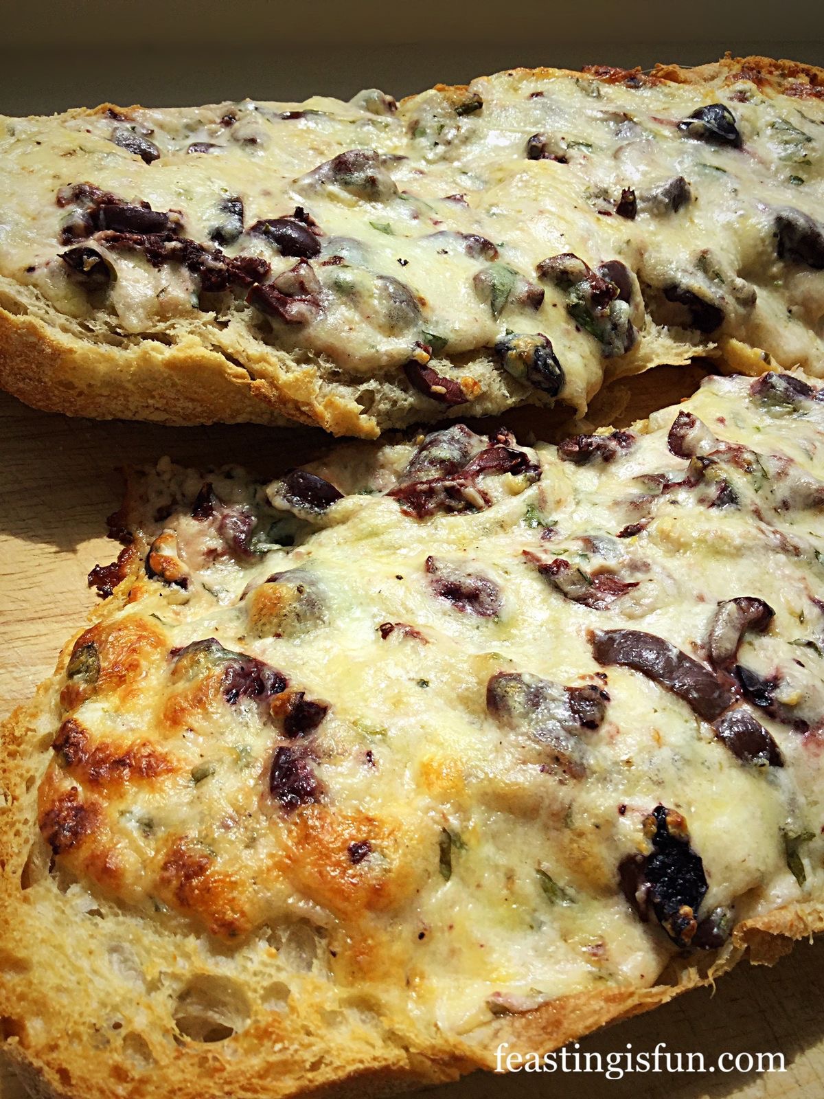 Baked Cheese Olive Ciabatta Bread - Feasting Is Fun