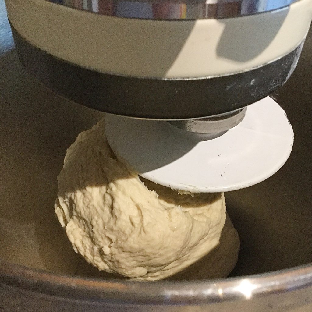 Mixing dough using a stand mixer.