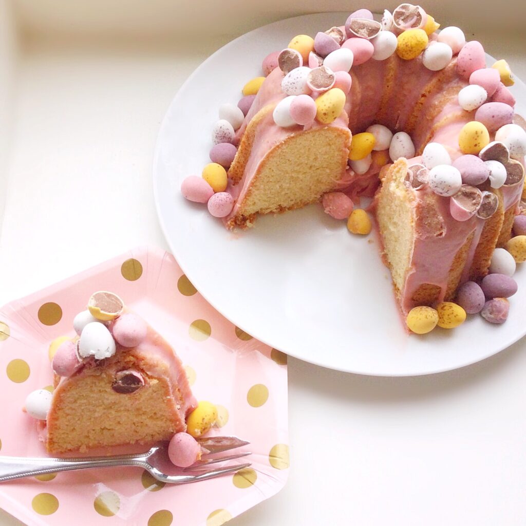 A slice cut from an Easter cake with both shown.